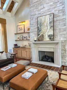 a living room filled with furniture and a fire place