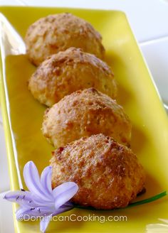 some food is sitting on a yellow plate with purple flowers in front of it,