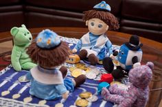 a group of stuffed animals sitting on top of a table