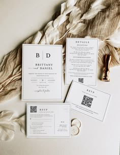 the wedding stationery is laid out on top of each other