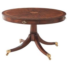 a wooden table with two drawers on one end and an oval shaped center piece on the other