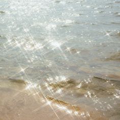 the sun shines brightly in the water at the beach