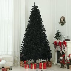 a black christmas tree with presents around it