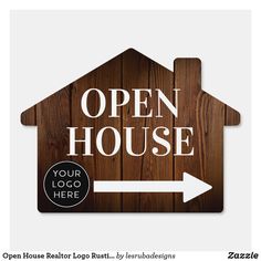 an open house sign is hanging on the wall