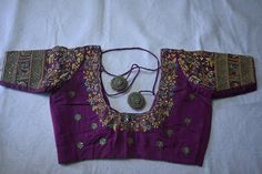 Purple shade kanchipuram silk blouse with beautiful hand emb (aari ) done with golden beads and stones. It can be customized to any colour and  size. Pl leave a msg for customization. Product colour may slightly vary due to photographic lighting sources or your device settings. For customization i will send you the measurement chart which you can fill and send it back to me . I ship to all places except germany. The standard shipment takes 35 working days. Speed  post takes 25 working days. Express delivery takes 7 working days. for entire gift options visit www.etsy.com/shop/esscube Wedding Banarasi Silk Blouse With Zari Work, Katan Silk Blouse With Resham Embroidery For Wedding, Designer Katan Silk Blouse With Zari Work, Katan Silk Blouse With Zari Work, Katan Silk Blouse With Zari Work For Designer Wear, Embroidered Banarasi Silk Wedding Blouse, Embroidered Banarasi Silk Blouse For Wedding, Traditional Katan Silk Blouse With Zari Work, Festival Katan Silk Blouse With Resham Embroidery