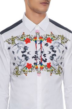 Adorned with vibrant multicolored floral patterns inspired by the lively backdrop of lush green gardens, this collar shirt will surely revamp your party wear wardrobe. Team up with black trousers and brogues for a modern and new-age look! Cotton cottons lends a fine, luxe vibe. 
Collar shirt
Full sleeves
Floral print detailing - Aza Fashions Designer Shirt For Party In Spring, Designer Shirt For Spring Party, Designer Party Shirt For Spring, Designer Spring Party Shirt, Designer Multicolor Floral Print Shirt, Designer Multicolor Print Tops For Summer, Designer Multicolor Print Tops For Spring, Designer Multicolor Print Summer Tops, Multicolor Floral Print Top With Collared Neckline