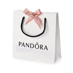 a white paper bag with a pink bow on it's handle that says pandara