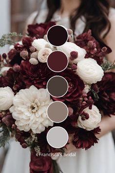 a bride holding a bouquet with burgundy and white flowers in it's centerpiece