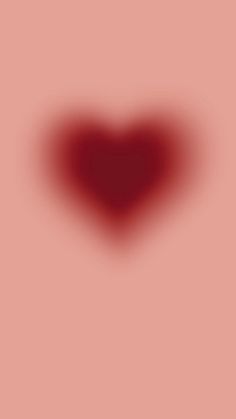 a red heart shaped object is shown on a pink background with the shadow of a person standing in front of it