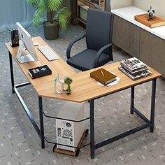 an office desk with a computer on it and a chair next to it in front of a bookshelf