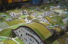 an aerial view of a model town with houses and trees