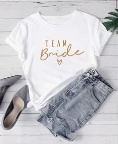 Introducing our Team Bride T-Shirt, specially crafted for Brides and or Bridesmaids. This shirt is: Perfect for bachelorette parties and bridal showers Lightweight and breathable fabric for comfortable wear in warm weather Stylish "Team Bride" print to show off your bridal party pride Versatile design can be dressed up or down for any occasion Great gift for the bride-to-be and her Made from premium quality, breathable cotton, this t-shirt offers maximum comfort while you effortlessly drop sarca Bride To Be Outfit, Diy Tshirt, Team Bride Shirts, Womens Apparel, Bride Shirts, Bride Clothes, Bachelorette Parties, Team Bride, T Shirt Diy