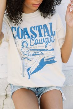 Coastal Cowgirl Tee Trendy Cotton T-shirt For Rodeo, Western Cotton Tops For Summer, Cotton Graphic Tee For Rodeo, Cotton Graphic Tee Tops For Rodeo, Graphic Cotton Tops For Rodeo, Vintage Cotton Tops For Rodeo, Cotton Tops For Rodeo In Summer, Western Style Cotton T-shirt For Country Concerts, Relaxed Fit Cotton Western Top