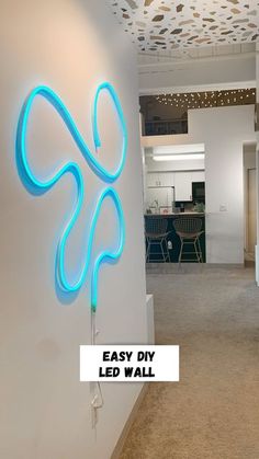 an easy diy led wall sign is displayed on the wall in this office space