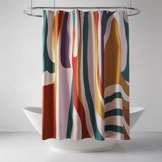 a colorful shower curtain hanging on a hook