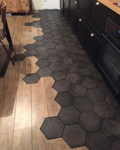 a kitchen floor with hexagonal tiles on it