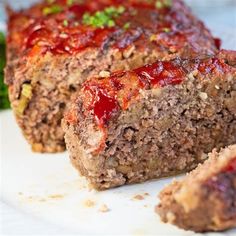 sliced meatloaf with ketchup and parsley on the side