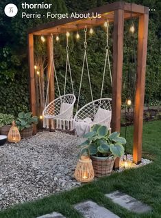 an outdoor patio with hanging chairs and potted plants