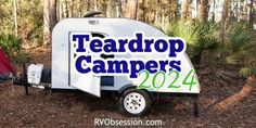 a camper trailer with the words teardrop campers on it's side