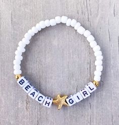 Beach ⭐️Girl Bracelet  Sand. Salt. Sea. 18k gold filled starfish bead The perfect bracelet for the Beach Girl 🐚 Made with white 6mm seed beads, gold accents, gold starfish bead and 4mm (smaller) square letters that read "BEACH GIRL" If you would like another word or color, please put in Personalization Section* and we will message you if we have any questions.  CARING TIPS FOR YOUR JEWELRY ⭐️Treat and store with care. ⭐️ For longevity, avoid exposing your jewelry to water. ⭐️ Avoid having direc Cute Beach Jewelry With Letter Beads, Adjustable Star Bracelets For The Beach, White Star-shaped Adjustable Beaded Bracelets, Adjustable White Star-shaped Beaded Bracelets, White Letter Beads Friendship Bracelets For Beach Season, Letter Beads Bracelets For Beach Season Gifts, Adjustable White Bracelet With Starfish Charm, Adjustable Beaded Bracelet With Starfish Charm As Gift, White Strand Bracelets With Starfish Charm