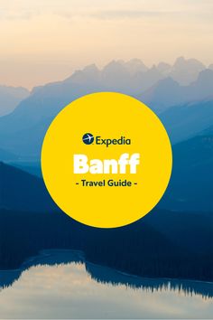 a yellow circle with the words banff travel guide on it in front of mountains