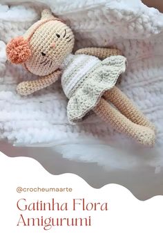 a crocheted doll laying on top of a white blanket with the caption gatina flora amigurmi