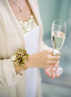 a woman holding a wine glass in her right hand and an instagram on the left