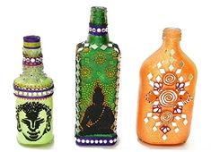 three different colored bottles with designs on them