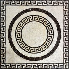 a black and white tile with a circular design on it