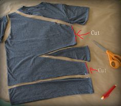 the cut out shirt is shown with scissors and thread