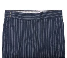 A must-have style in every man’s wardrobe, you will never look boring again with these striped trousers in blue and white. Elegantly made with high quality craftsmanship in a straight fit, flat-front style from premium quality cotton, these trousers feature a button and zip closure with a wide waistband with two extended fastening tabs. This pair of men's pants is perfect for work and everyday wear, business meetings, parties, gala dinners or summer weddings. Buy it for yourself, or gift it to a Fitted Blue Bottoms With Vertical Stripes, Blue Fitted Bottoms With Vertical Stripes, Fitted Blue Pants With Vertical Stripes, Formal Bottoms With Vertical Stripes For Summer, Fitted Striped Bottoms With Welt Pockets, Formal Summer Bottoms With Vertical Stripes, Fitted Striped Pants With Welt Pockets, Classic Vertical Stripes Bottoms For Summer, Classic Bottoms With Vertical Stripes For Summer