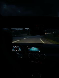 the dashboard of a car at night time