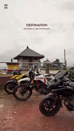 two motorcycles parked next to each other in front of a building with a sign that says destination