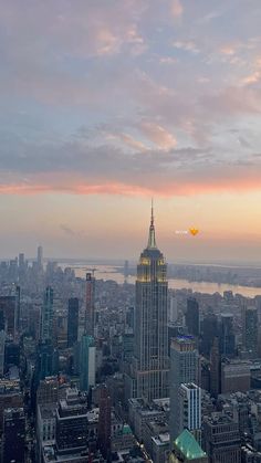 an aerial view of the empire building in new york city, ny at sunset or dawn