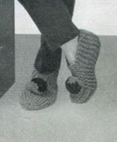 a person wearing slippers standing on top of a white floor next to a black and white photo