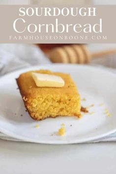 a piece of cornbread sitting on top of a white plate