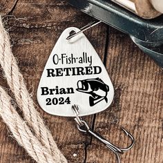 there is a keychain that says, o - fish ally retired britain 2012