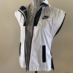 Brand New With Tag. Color Black And White. Size Xs. Nike Urban Style White Windbreaker, White Athleisure Outerwear For Streetwear, Casual Fitted White Windbreaker, White Nike Windbreaker For Fall, Nike White Sporty Outerwear, Nike White Casual Outerwear, Nike Casual White Outerwear, White Sportswear Windbreaker For Spring, Casual White Nike Outerwear