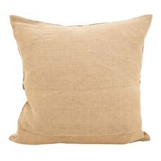 a beige pillow on a white background