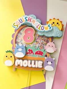 there is a cake topper with the name mollie on it and other decorations