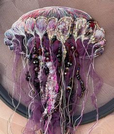 there is a jellyfish with many beads on it