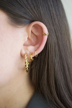 You'll want to sweep your hair high and let your cartilage show with our snake hoop earring.  Material: 316L Surgical steel OR 316L Surgical steel + quality PVD tarnish-resistant plating Gauge: 16g (1.2 mm) Size (length/diameter): 8mm (standard size) OR Size (length/diameter): 10mm  Most suitable for: Cartilage, daith, rook, nose hoop, septum, earlobe  How to put on/remove: Hinged clicker hoop, making it easy to take on and off ** This item is final sale due to hygienic purposes we cannot accept Trendy Hypoallergenic Hoop Ear Cuff, Trendy Hoop Ear Cuff With Piercing, Trendy Single Hoop Cartilage Earring, Internally Threaded Hoop Huggie Earrings, Spiral Ear Cuff, Helix Hoop Earring, Helix Earrings Hoop, Hoop Septum, Helix Hoop