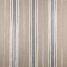 an upholstered beige and blue striped fabric