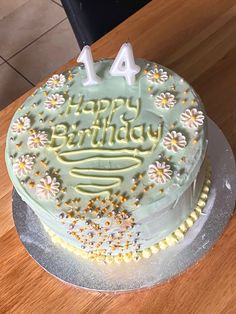 a birthday cake sitting on top of a wooden table