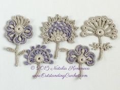 four embroidered flowers on a white background