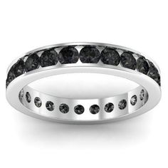 a white gold ring with black diamonds