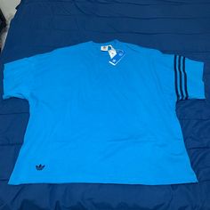 Brand New, Blue Adidas Shirt, Size Xl , Material Heavy Duty Long Lasting Soft Material , Cotton Blue Cotton V-neck Shirt, Blue Sporty Shirt For Streetwear, Blue Sporty Streetwear Shirt, Sporty Blue Shirt For Streetwear, Blue T-shirt With Three Stripes Branding For Streetwear, Blue Sporty V-neck T-shirt, Blue Crew Neck Shirt For Streetwear, Blue Relaxed Fit Top For Streetwear, Casual Blue Tops For Streetwear