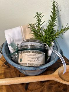 a wooden spoon sitting on top of a bowl filled with scrubs