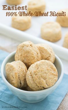 a white bowl filled with cookies on top of a blue napkin