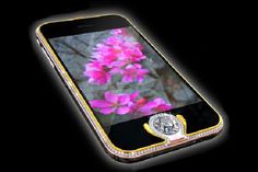 an image of a cell phone with flowers on the screen and diamond trimmings